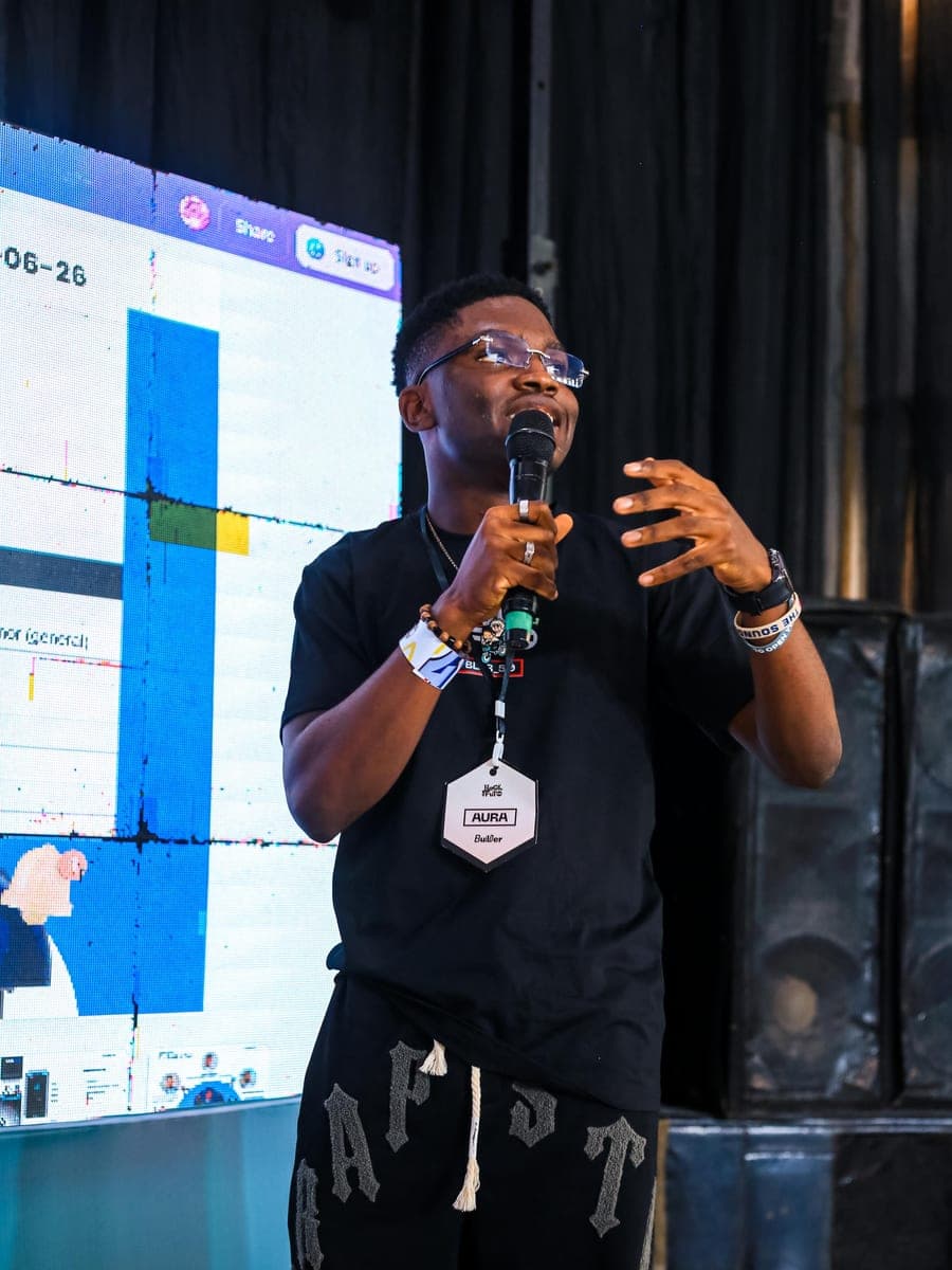 Jackson speaking at Hack4FUTO with the AURA slides behind him